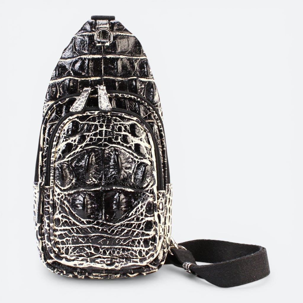 VEARI bicolor black and light brown hornback crocodile leather sling backpack with zip pockets.