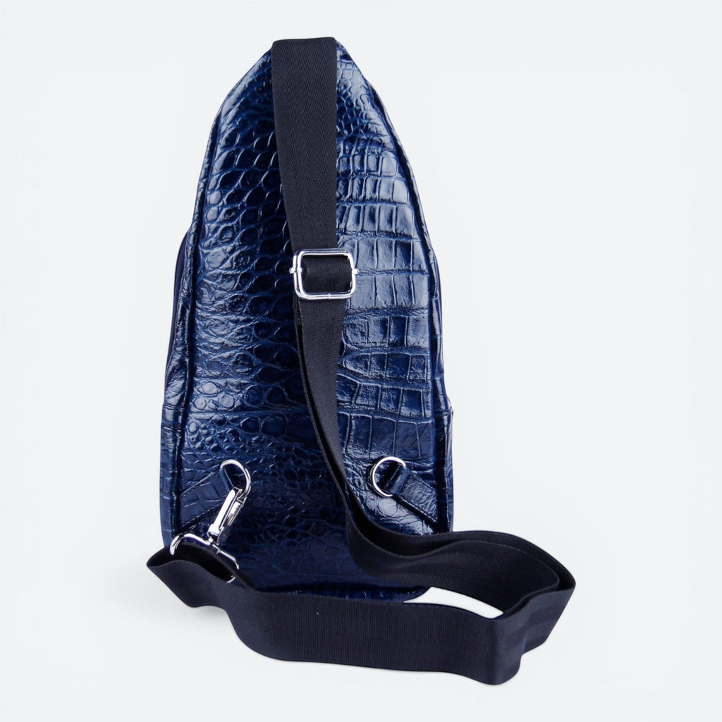 VEARI blue hornback crocodile genuine leather sling backpack with zip pocket and organizer pockets.