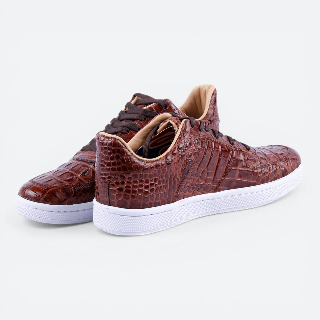 VEARI brown alligator leather low top sneakers with white soles and tan lining.