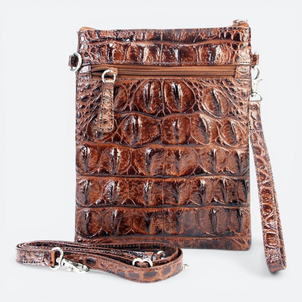 VEARI brown hornback crocodile leather carrier bag with zip pocket and organizer pockets. Includes wrist strap and crossbody strap.