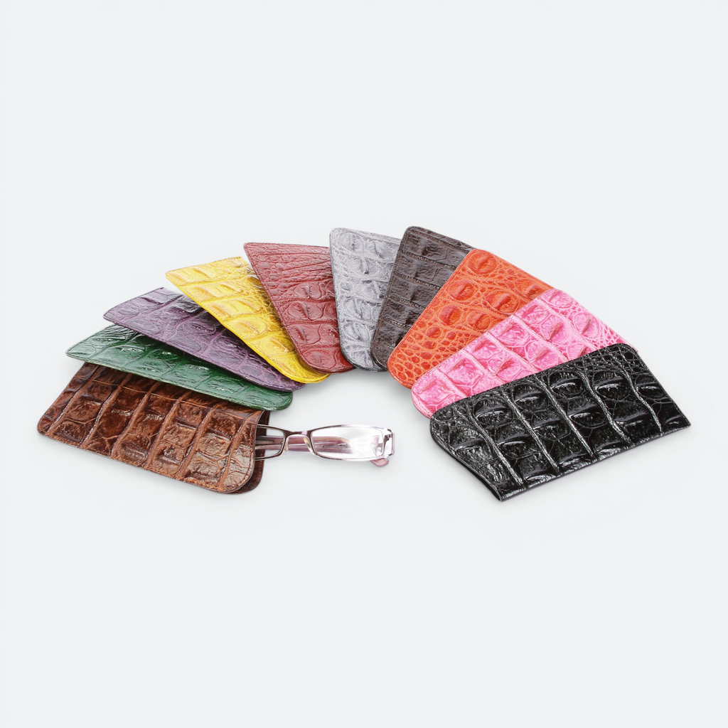VEARI hornback crocodile leather sunglass case in black, dark brown, light brown, orange, pink, red, yellow, purple, and green.