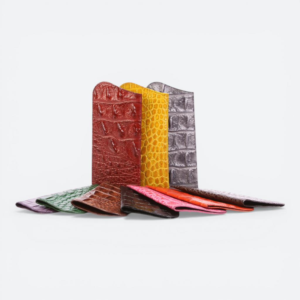 VEARI exotic sunglass case made of hornback crocodile leather in black, dark brown, and light brown.