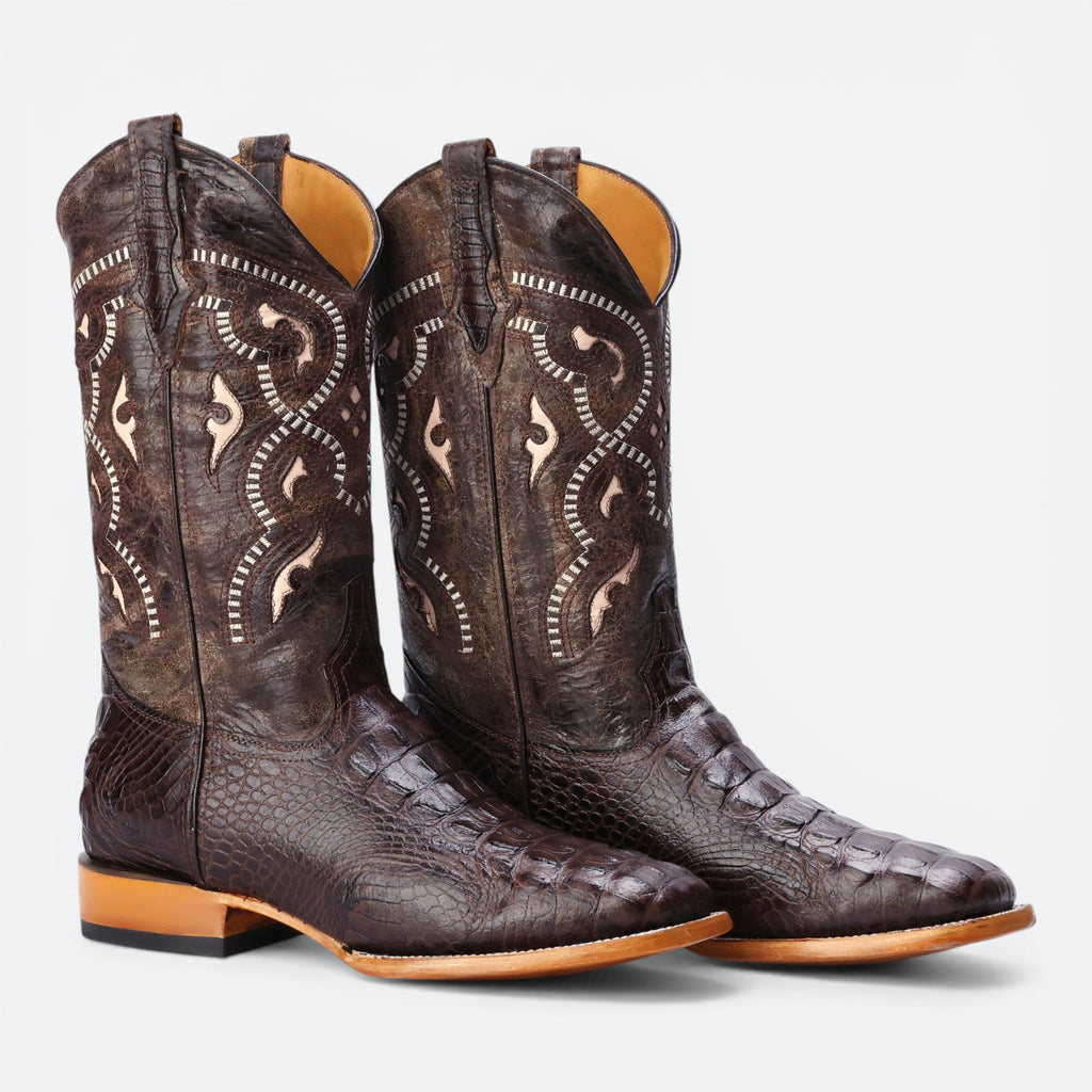 VEARI Buitre Rodeo Western Boots in dark brown alligator leather with intricate stitching and a leather sole.