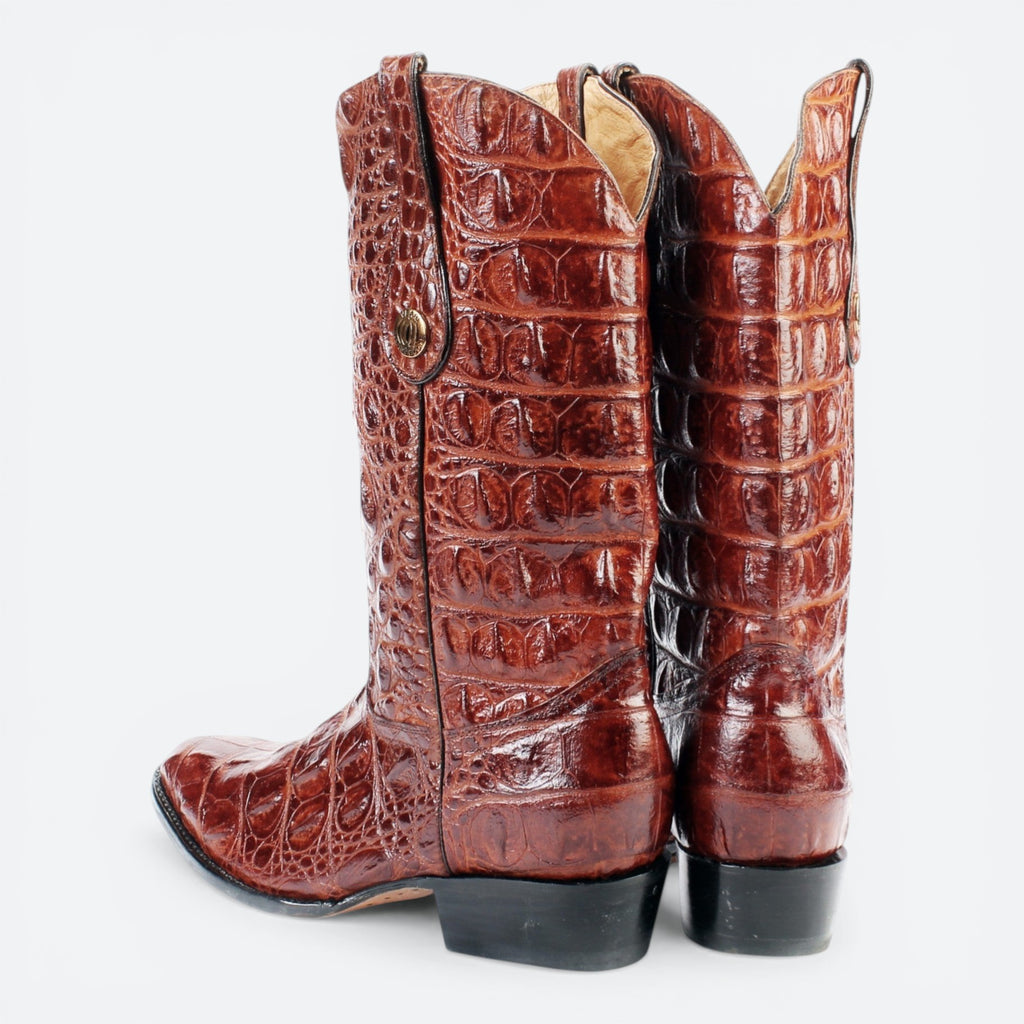 VEARI Buitre Western Boots in hornback crocodile leather, featuring a pointed toe and leather sole. Available in black, dark brown, and light brown.